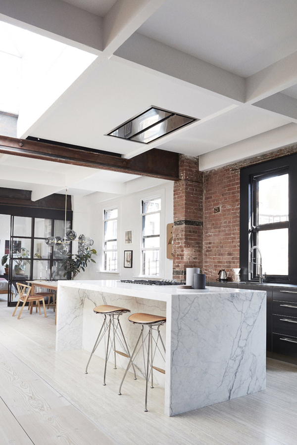 All Hail This Tribeca Family Loft With Dramatic Brick And Elegant  Industrial Details kitchen with textured ceiling, white back splash and  island - Luxe Interiors + Design