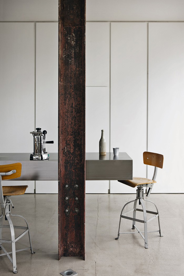 This loft is a successful mix of high and low spec with a rusty steel RSJ showstopper.